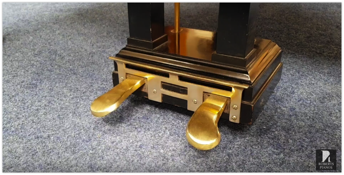Seiler grand piano pedals with brass backboard
