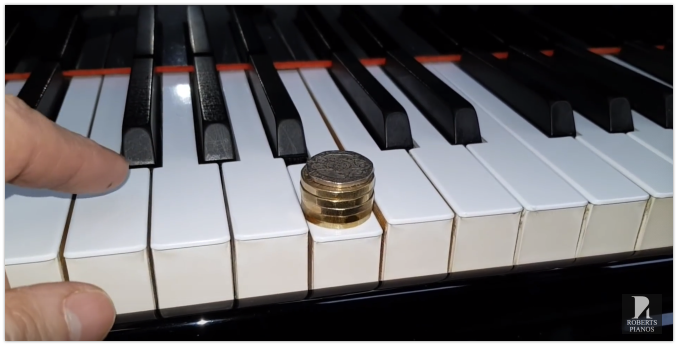 Key weight measuring on a Yamaha G2 grand piano for sale